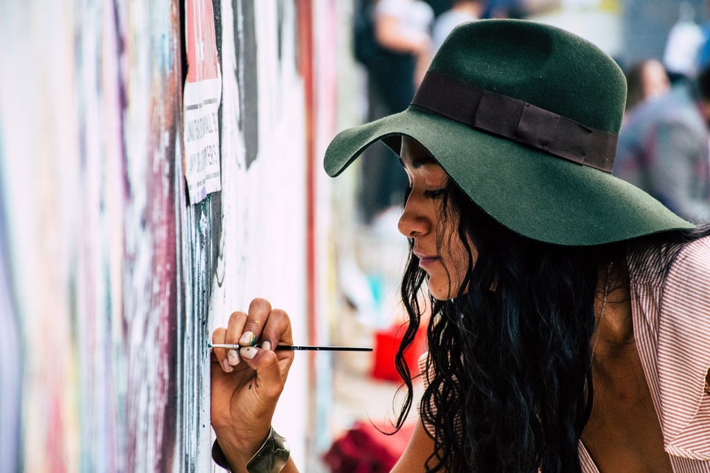 Woman Painting on a Wall